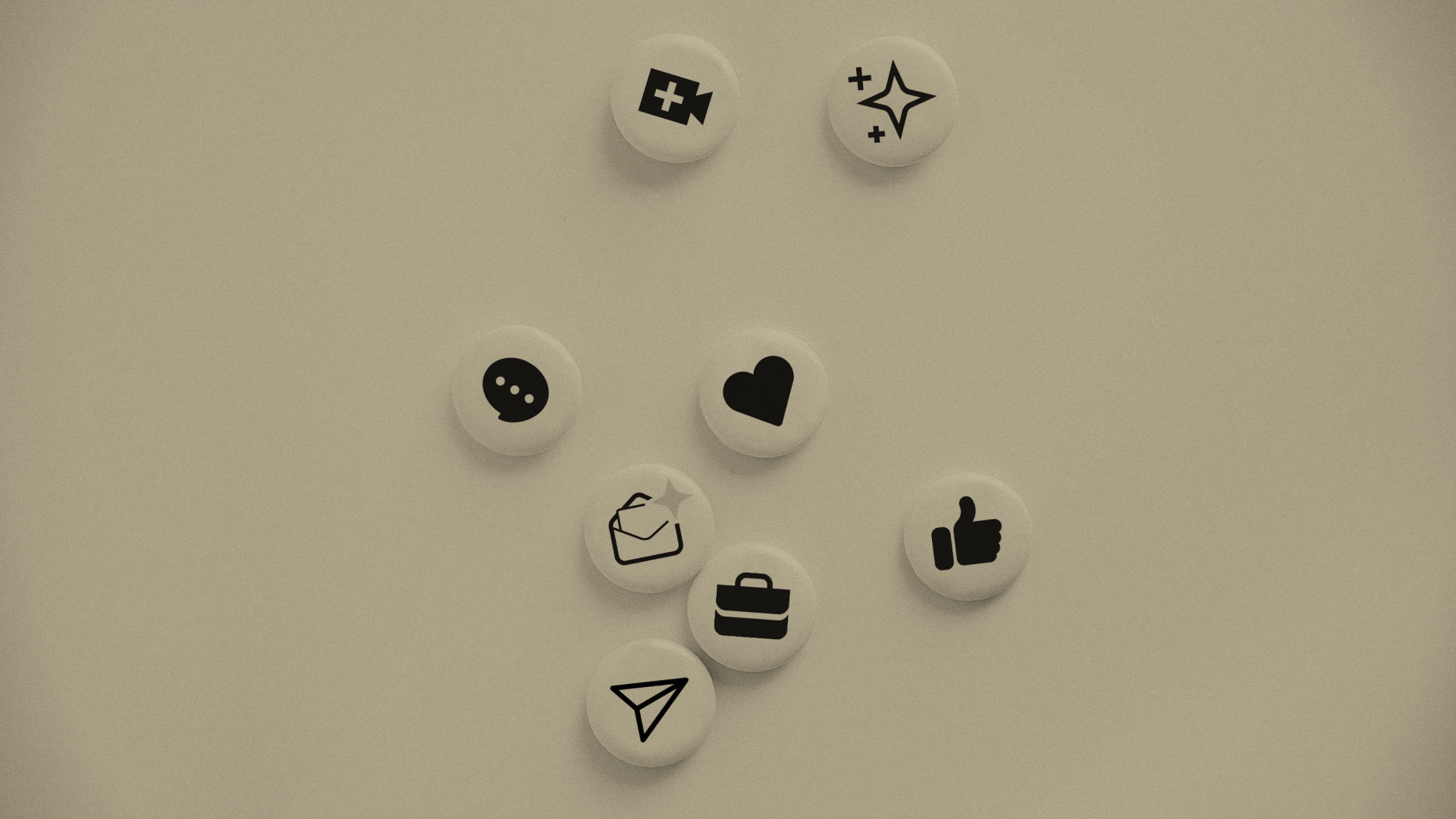 Mehrere weiße Buttons mit schwarzen Symbolen liegen auf hellem Hintergrund. Zu sehen sind Icons für Erste Hilfe, Glanz, Sprechblase, Herz, Briefumschlag, Aktentasche, Daumen hoch und Papierflieger.